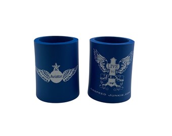 May include: Two blue foam can coolers with white designs. One cooler has a white star and wings with the word "Aviator" inside a circle. The other cooler has a white cross with wings and the text "Live to Fly" with the website "airpeedjunkie.com".