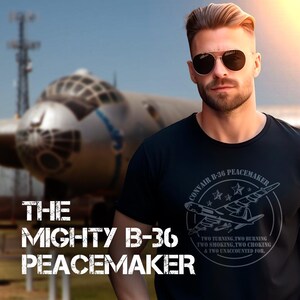 May include: Black t-shirt with a graphic of a Convair B-36 Peacemaker bomber. The text on the shirt reads "CONVAIR B-36 PEACEMAKER" and "TWO TURNING, TWO BURNING, TWO SMOKING, TWO CHOKING & TWO UNACCOUNTED FOR." The words "THE MIGHTY B-36 PEACEMAKER" are also displayed.