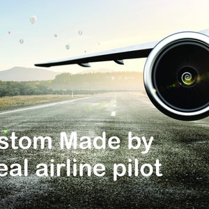 May include: A close-up of an airplane engine on a runway with a blue sky and white clouds in the background. The text "Custom Made by a real airline pilot" is in the foreground.