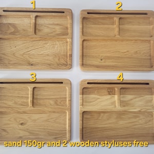 May include: Four rectangular light brown wooden trays, each featuring a long horizontal slot at the top and three recessed compartments below. The text at the bottom reads: sand 150gr and 2 wooden styluses free. The trays have visible wood grain.