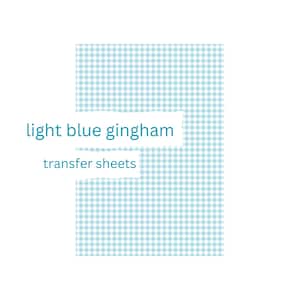 May include: Light blue gingham transfer sheets. A light blue and white checked pattern is visible, with the words "light blue gingham" and "transfer sheets" in a teal font.