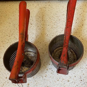 Red Potato Ricer. Old Metal Masher. Red Kitchen Utensil Gadget. Old Kitchen Red Decor. Vintage Red Metal Appliance