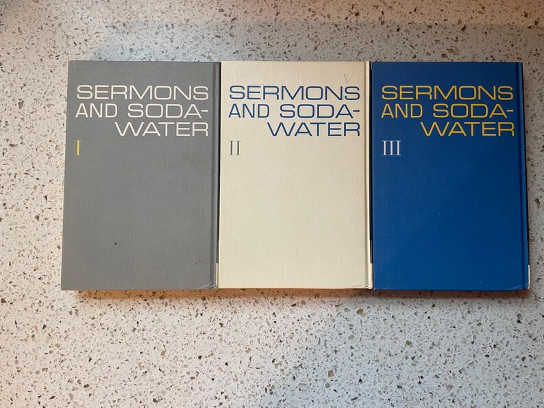 May include: Three gray, white, and blue hardcover books titled "Sermons and Soda-Water" with Roman numerals I, II, and III on the spines.