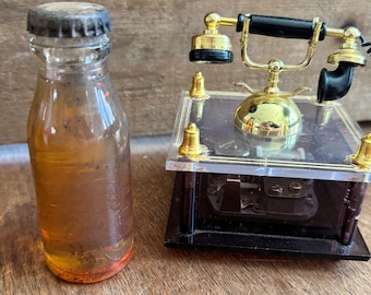 Wahl T Edison Sammlerstück. Mini-Telefon Spieluhr. Edison Batterieöl in Flasche Bloomfield NJ Erinnerungsstücke.
