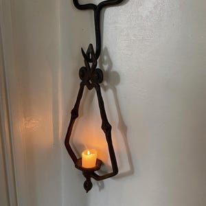 Cast Iron Candle Holder. Hanging Wall Sconce. Black Iron Hanging Sconce.  Indoor/Outdoor Candle Holder. Eye Catching, Stunning.