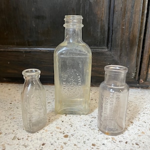 Small Embossed Bottles. Collectible Advertising Bottles. Singer, Baby Doll w Dog, Antidolor Small Collectible Bottles. Choice or All