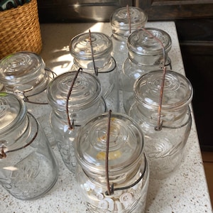 Quart Mason Ideal Jar. Mason Jar Wire Bail Lid. Vintage Worn Bail Lid.  Time Period 1923 - 1933. Sold Per Jar.