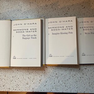 May include: Three paperback books with white covers and black text. The books are titled "Sermons and Soda-Water" by John O'Hara. The first book is volume I, "The Girl on the Baggage Truck". The second book is volume II, "Imagine Kissing Pete". The third book is volume III, "We're Friends Again".