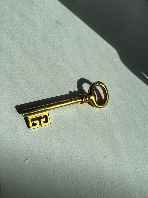 Givenchy gold key brooch