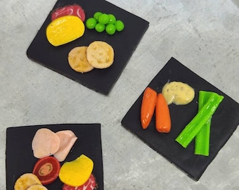 plate of charcuterie board items, assorted