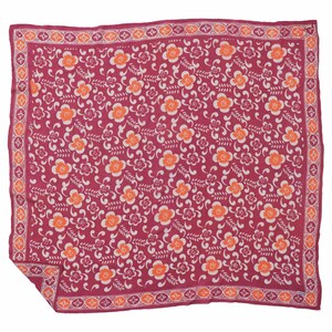 May include: A square scarf featuring a deep magenta background with a repeating pattern of orange and white flowers, interspersed with white leafy sprigs. The scarf is framed by a decorative border containing orange circles and white floral motifs.