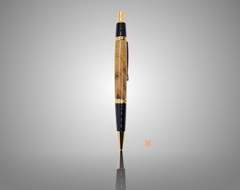 Wall Street click pen; made from Myrtlewood; 24kt gold plating and black accents; unique wood; great writer, teacher, back to school gift