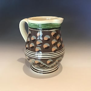 May include: A handmade wooden sign with the text "Welcome" in a playful font. The sign features a distressed finish and a simple, rustic design, perfect for a front door or entryway.