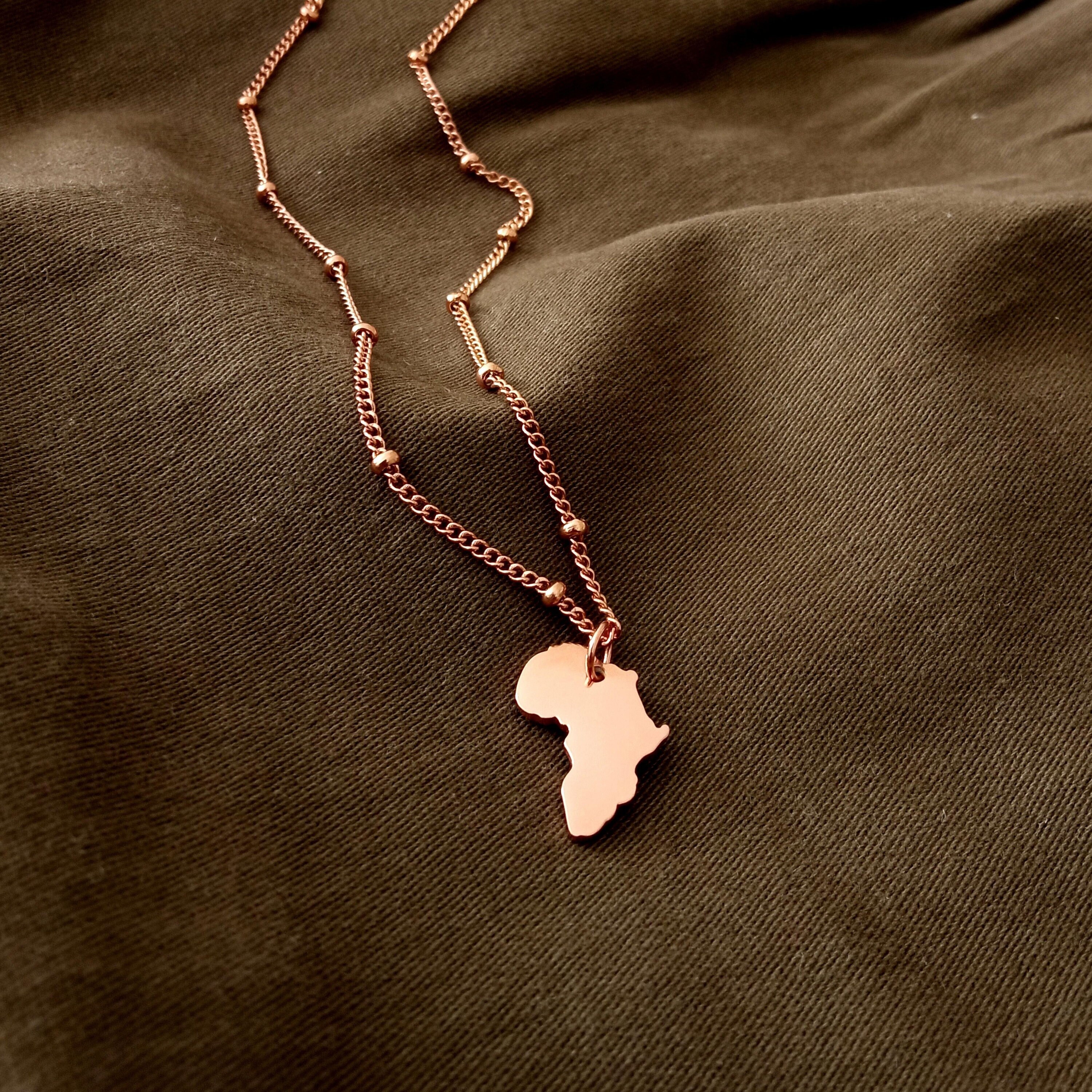 Rose gold africa pendant deals