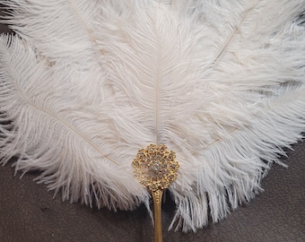 Medium jeweled white ostrich feathers and gold stainless Steel handle