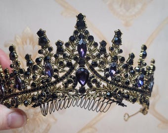 Dark purple center stones on black and gold tiara