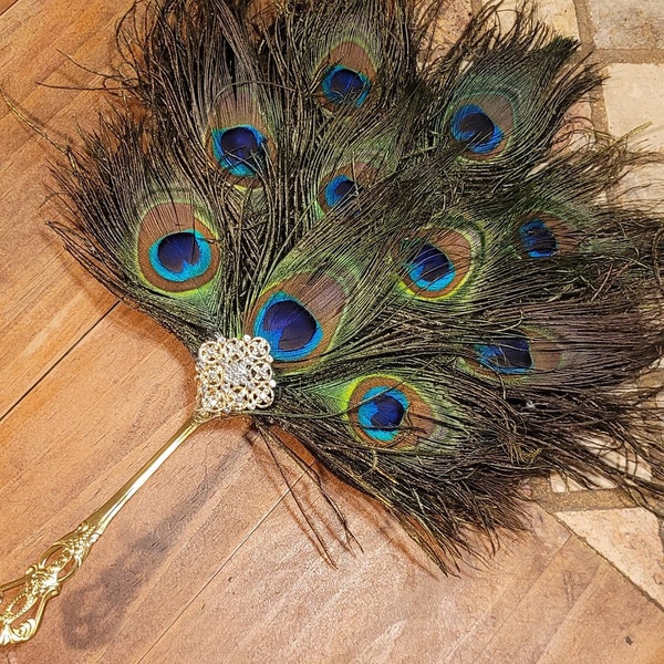 Medium jeweled peacock feathers and gold stainless Steel handle super lightweight