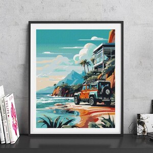 May include: A framed print of a colorful illustration depicting a beach scene with a house, palm trees, and a car driving on the sand. The print is hanging on a wall above a shelf with books and a mug.