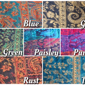 May include: A collage of ten fabric swatches in various colors and patterns, including blue, gold, green, paisley, purple, rust, and teal. Each swatch features a paisley design.
