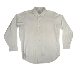 May include: A white long-sleeve dress shirt with a button-down collar and a single pocket on the left chest.