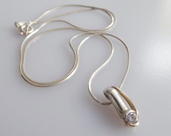 Danish Scrouples silver, gold and zirconia pendant, together with a silver chain necklace