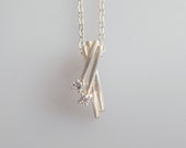 Danish Guld og Sølv Design silver and zirconia criss-cross pendant and chain necklace