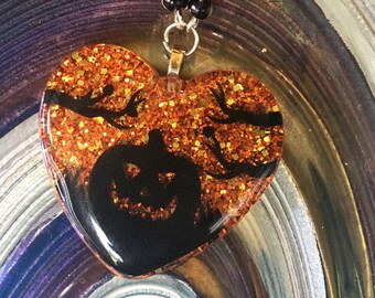 Jack o Lantern Silhouette on Orange Glitter Resin Pendant Necklace