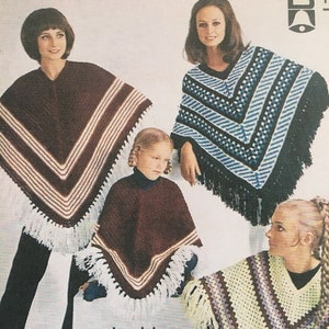 May include: Four people wearing different coloured and patterned ponchos with fringe. The ponchos are all knitted in a double knit stitch. The text "double knitting" and "Girls and Womens sizes in all designs" is printed below the image.