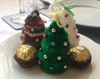 Laminated DK knitting pattern to make a mini Christmas tree to cover Ferrero Rocher Maltesers truffles Lindor chocolates