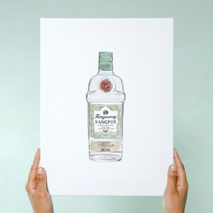 May include: A hand-drawn illustration of a clear glass bottle of Tanqueray Rangpur gin. The bottle has a green label with the text "Tanqueray Rangpur Distilled Gin With Rangpur Limes" and a red seal.