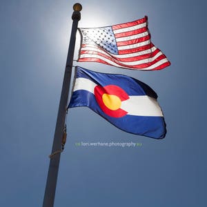 Colorado and United States Flags on a blue sky day!