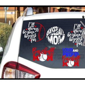 May include: A white car with a rear window covered in baseball-themed decals. The decals feature a baseball with the words "Baseball Mom" and "Loud and Proud Baseball Mom". Other decals say "I'll always be your biggest fan" with a baseball and a silhouette of a baseball player.