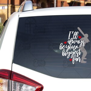 May include: White car window decal with a baseball player silhouette and the text "I'll always be your biggest fan" with red hearts. The number "#4" is in the bottom right corner.