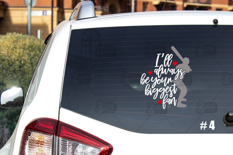 May include: White car window decal with a baseball player silhouette and the text "I'll always be your biggest fan" with red hearts. The number "#4" is in the bottom right corner.