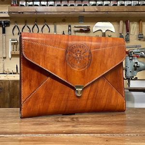 Exclusive documents and macbook case in hand colored best veg tan Italian leather, fully customizable
