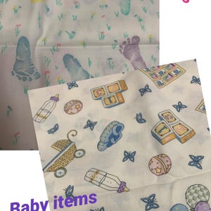 May include: White fabric with colorful baby footprints and baby items. The fabric features prints of baby bottles, blocks, rattles, and balloons. The text "Footprints" and "Baby items" are visible.