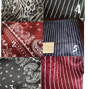 May include: A collage of six fabric swatches with various patterns. These include animal print, paisley, and striped designs in colors like black, white, red, and navy. The fabrics appear to be silk or satin.