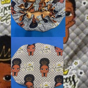 May include: Two satin bonnets. One is gray with a pattern of black-haired girls and the word "Princess". The other bonnet has a gold bow and trim. Both bonnets are designed for hair protection and styling.