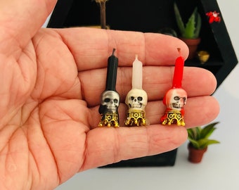 Set of 3 handmade candlestick skull bases. Set of 3 Miniature dripping candles.