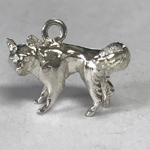 Wolf charm.