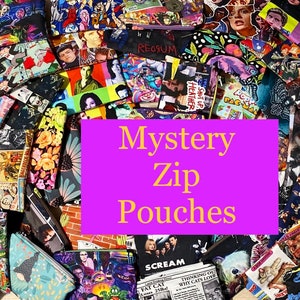 May include: A collection of colorful zip pouches with various patterns and designs. The pouches feature images of movie stars, floral prints, and other graphics. The text "Mystery Zip Pouches" is displayed on a purple background.