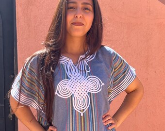 Light blue oriental dress with white embroidery and stripes