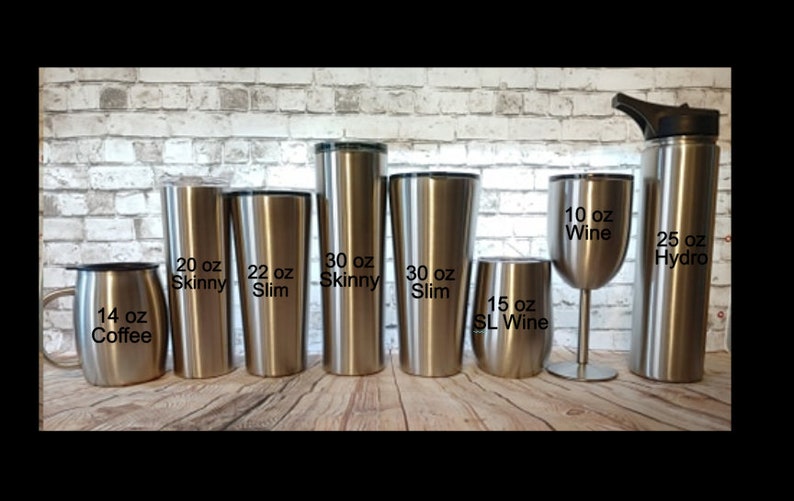 May include: A collection of stainless steel drinkware, including a 14 oz coffee mug, various tumblers labeled 20 oz Skinny, 22 oz Slim, and 30 oz Skinny and Slim, a 15 oz SL Wine tumbler, a 10 oz wine glass, and a 25 oz Hydro bottle.