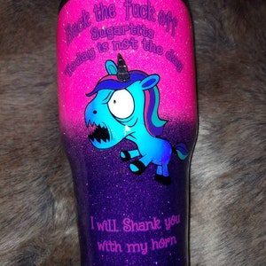 May include: A glittery tumbler with a gradient of pink and purple. It features a cartoon unicorn with the text "Back the fuck off Sugartits today is not the day" and "I will shank you with my horn."