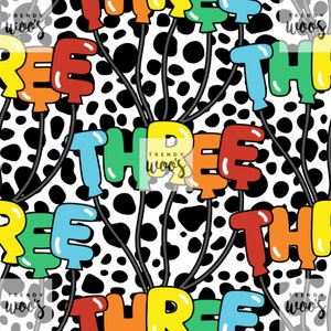 May include: A seamless pattern featuring colourful balloons spelling out the word "THREE" on a black and white dalmatian print background.