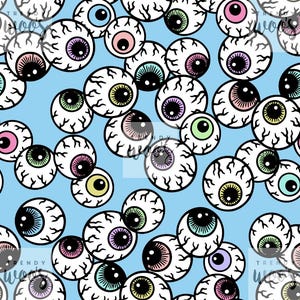 May include: A repeating pattern on a light blue background featuring multiple cartoon eyeballs with black pupils and irises in various colors including pink, green, yellow, and purple, all outlined in black with visible red blood vessels.