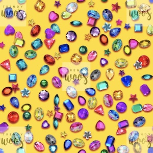 May include: A vibrant yellow background scattered with a variety of colorful, faceted acrylic gemstones in shapes including hearts, stars, ovals, rectangles, and teardrops. The text "TRENDY woos" appears in a semi-transparent overlay.