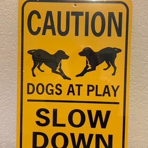 Señal de precaución: perros jugando, 30 x 45 cm
