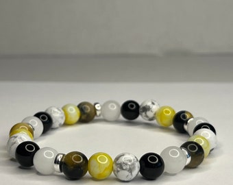 Citrine and Yellow Tiger eye, Pure white quartz, Onyx and Howlite with steel