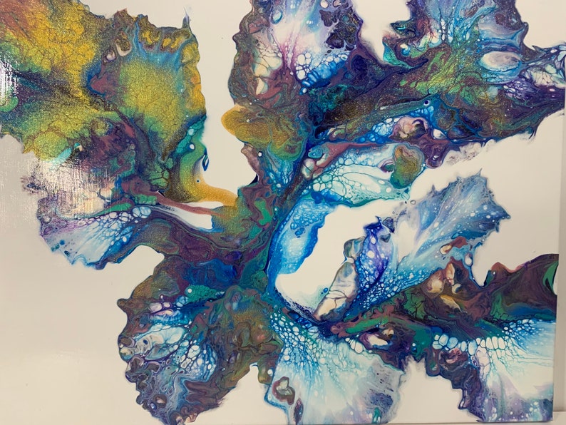 May include: Abstract painting with swirling blue, green, purple, and gold paint. The paint creates a flowing, organic design.